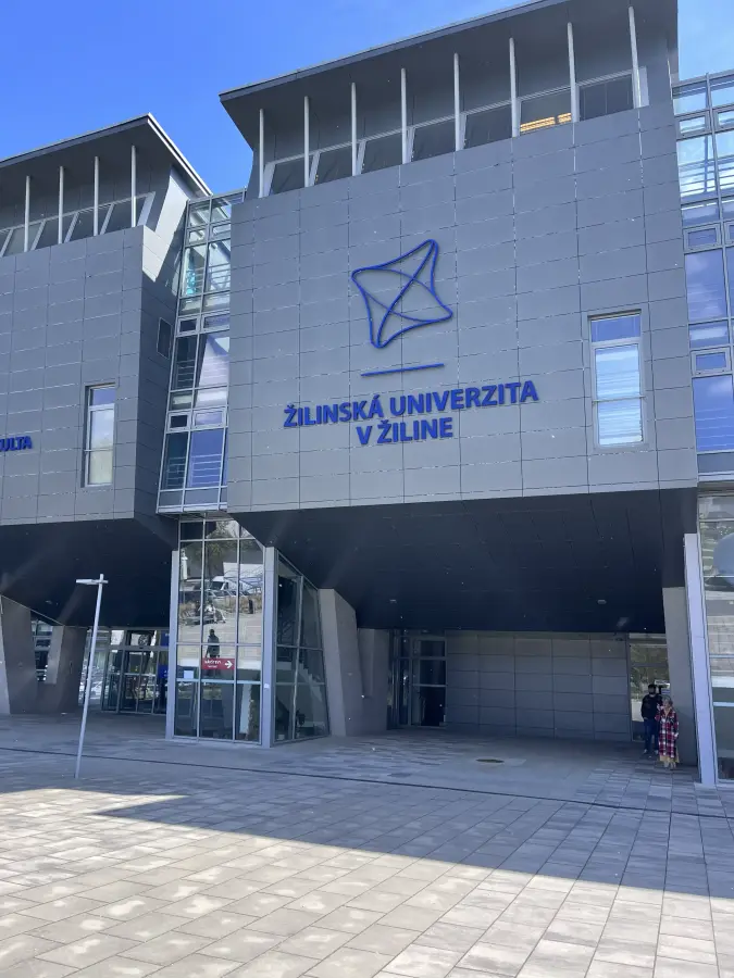 Main building of the University of Žilina in Slovakia, its name mounted on the grey facade.